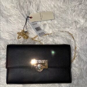 Ted Baker Black and Gold Clutch with Sleek Design